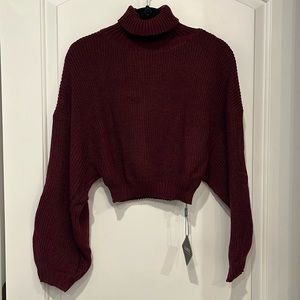 Cropped turtleneck, loose sleeved sweater